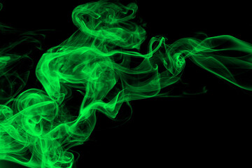 Green smoke abstract on black background. darkness concept