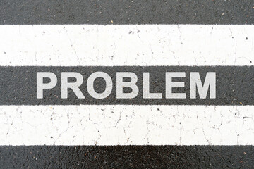 On the asphalt between the white dividing stripes the inscription - PROBLEM