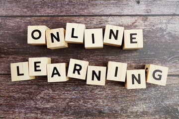 Fototapeta premium Online Learning word alphabet letters on wooden background