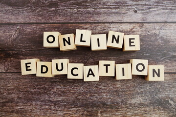 Fototapeta premium Online Edcucation word alphabet letters on wooden background