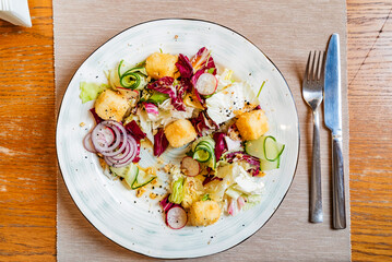 tasty salad, with cheese and vegetables