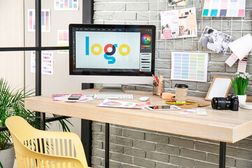 Comfortable workplace of graphic designer in office