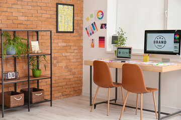 Comfortable workplace of graphic designer in office