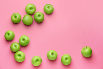 Fresh green apples on color background