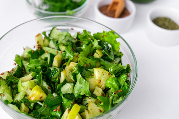 Salad of fresh green vegetables and herbs. Cooking healthy diet or vegetarian food. Step by step...