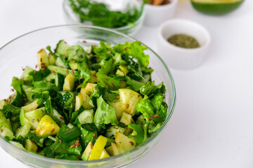 Salad of fresh green vegetables and herbs. Cooking healthy diet or vegetarian food. Step by step...