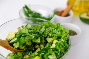 Salad of fresh green vegetables and herbs. Cooking healthy diet or vegetarian food. Step by step...