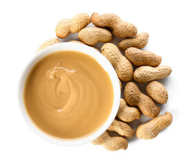 Bowl with tasty peanut butter on white background