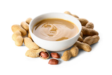 Bowl with tasty peanut butter on white background