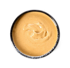 Bowl with tasty peanut butter on white background