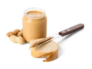 Jar with tasty peanut butter, bread and knife on white background