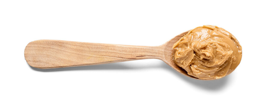 Spoon with tasty peanut butter on white background - Powered by Adobe