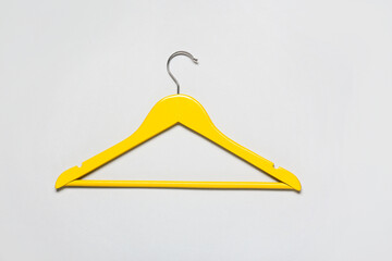 Stylish clothes hanger on light background