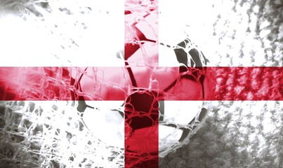Soccer ball inside the net, with the English flag as background. Concept of England Soccer team