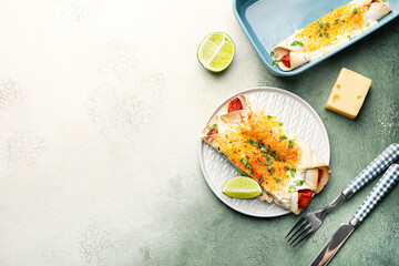 Tasty cooked enchilada on color background