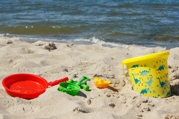 Fototapeta na wymiar Children toys for relax or playing on sand at beach. Vacation time