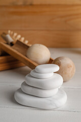 Stack of spa stones on wooden table