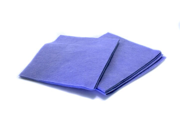 Folded blue rag from synthetic fabric for home cleaning on white background. Isolated. 