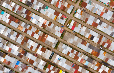 garages on the edge of the city, taken from above by a drone