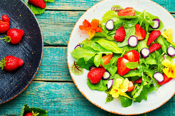 Summer salad with berries and herbs