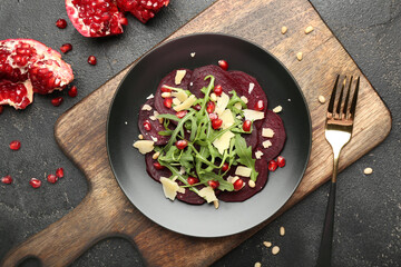 Composition with delicious beetroot carpaccio on dark background