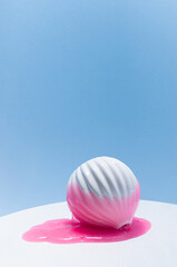 Modern contemporary abstract still life - idea of overflow and drabble glamour fashion. Pink slime with gold glowing glitter flow down of white vase in puddle.