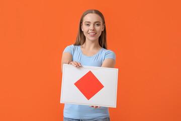 Young woman with letter on color background