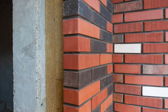 Section Of A Brick Wall With Insulation Of A New House Under Construction