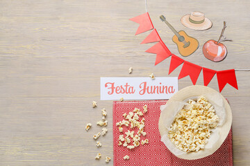 Composition with popcorn for Festa Junina (June Festival) on wooden background