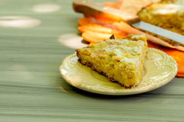a knife and a cut piece of shortbread on the garden table on a sunny day