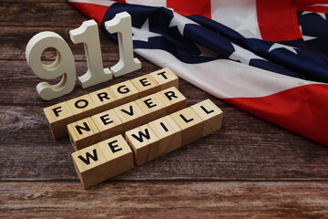 Fototapeta premium 911 We will Never Forget Word alphabet letters on wooden background