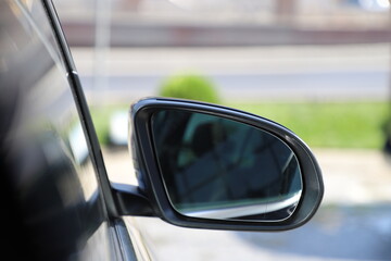 Rearview mirror on a modern car. Car side mirror.