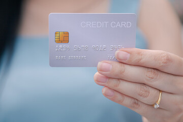 Closeup hand takes of credit card for financial transactions