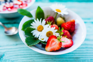 Healthy and delicious fresh strawberry fruit in a bowl.