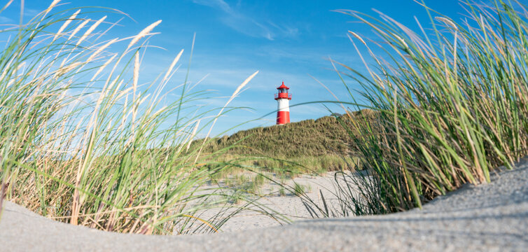 Dune beach and lighthouse near the North Sea coast on Sylt, Schleswig-Holstein, Germany