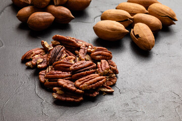 Close up heap of pecan on the black table