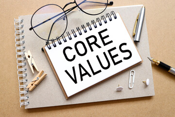 Core Values. text on paper, on a notebook on a craft background, near glasses