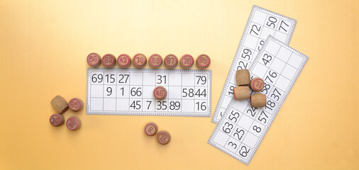 A lotto game with paper cards and barrels. An interesting puzzle board game.