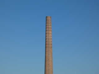 Old unused factory brick chimney.