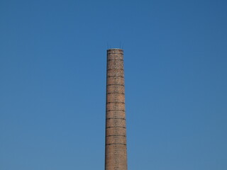 Old unused factory brick chimney.