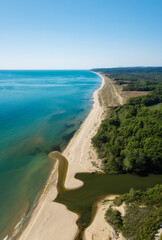 Fototapeta na wymiar Beautiful aerial view of a sandy beach and a river that flows into the sea, the mouth of Kamchia River at the Black sea coast, Bulgaria