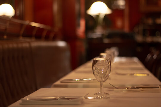 Slow Travel In Paris - Looking At The Details: Looking Inside A Closed Restaurant At Night With The Tables Already Set For The Next Day