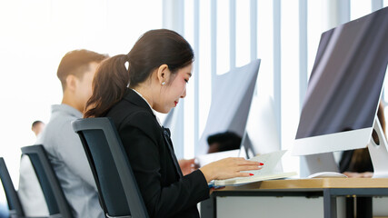Happy business woman in office.