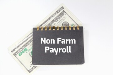 banknotes, notebooks with the words NON FARM PAYROLL