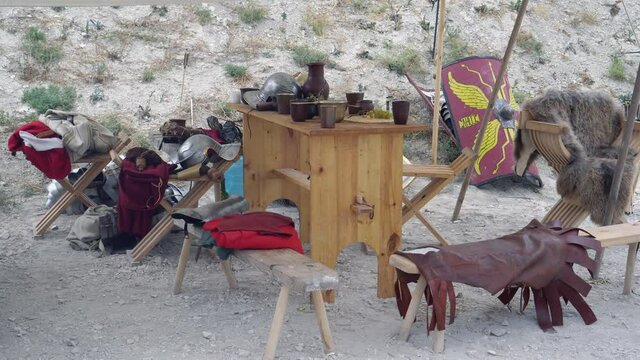 The camp of the Roman legionaries. Historical weapons, military equipment: shield sword helmet and armor, Pylum-throwing spear