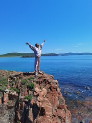 girl on the rock in sunny day