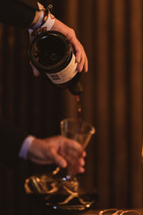 Sommelier decanting a bottle of red wine 