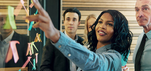 Woman explaining the plan to office team
