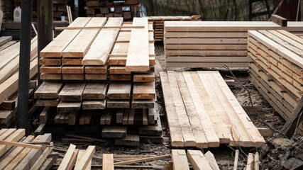 Sawn and stacked timber. Outdoor warehouse and production