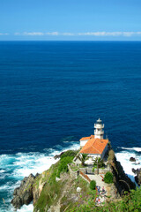 Fototapeta na wymiar Cudillero's Ligthhouse, Cliffs and Huge Rocks, Cudillero, Asturias, Spain, Europe